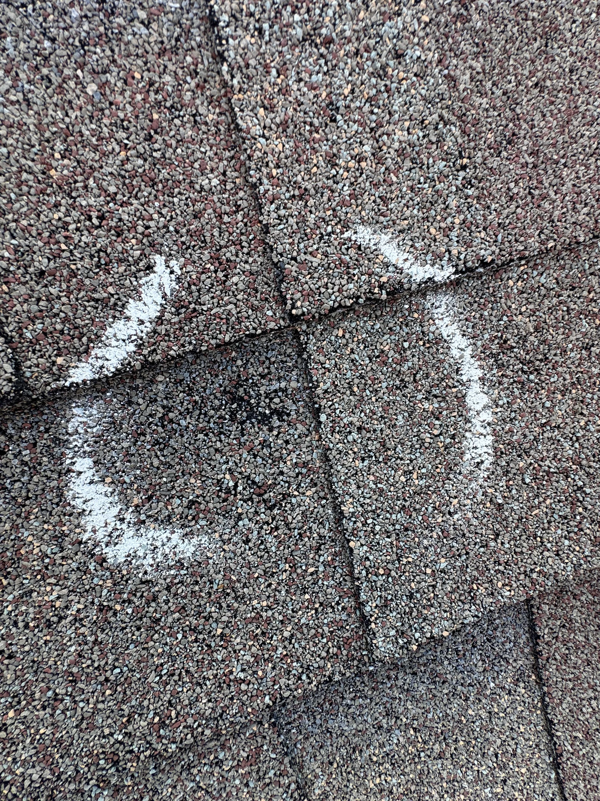 Chalk circled hail bruises brown shingles, Pflugerville, TX