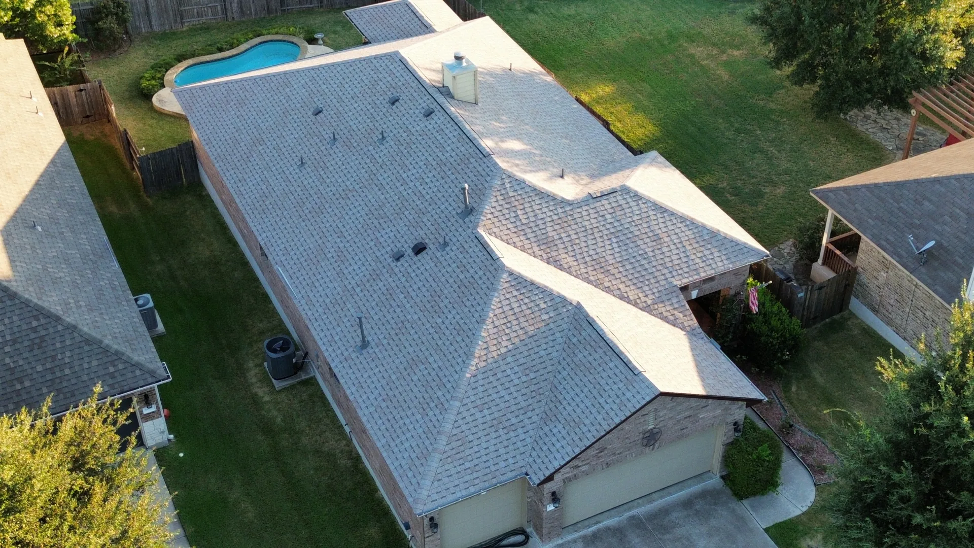 Drone tan shingle roof inground pool, Hutto, TX